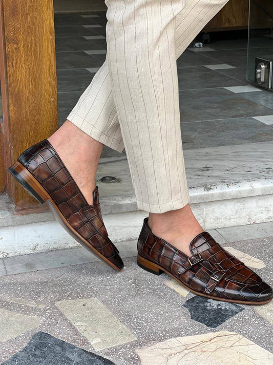 Stylish brown monk strap shoes with a textured leather finish and double buckle design, ideal for spring-summer formal and semi-formal wear.