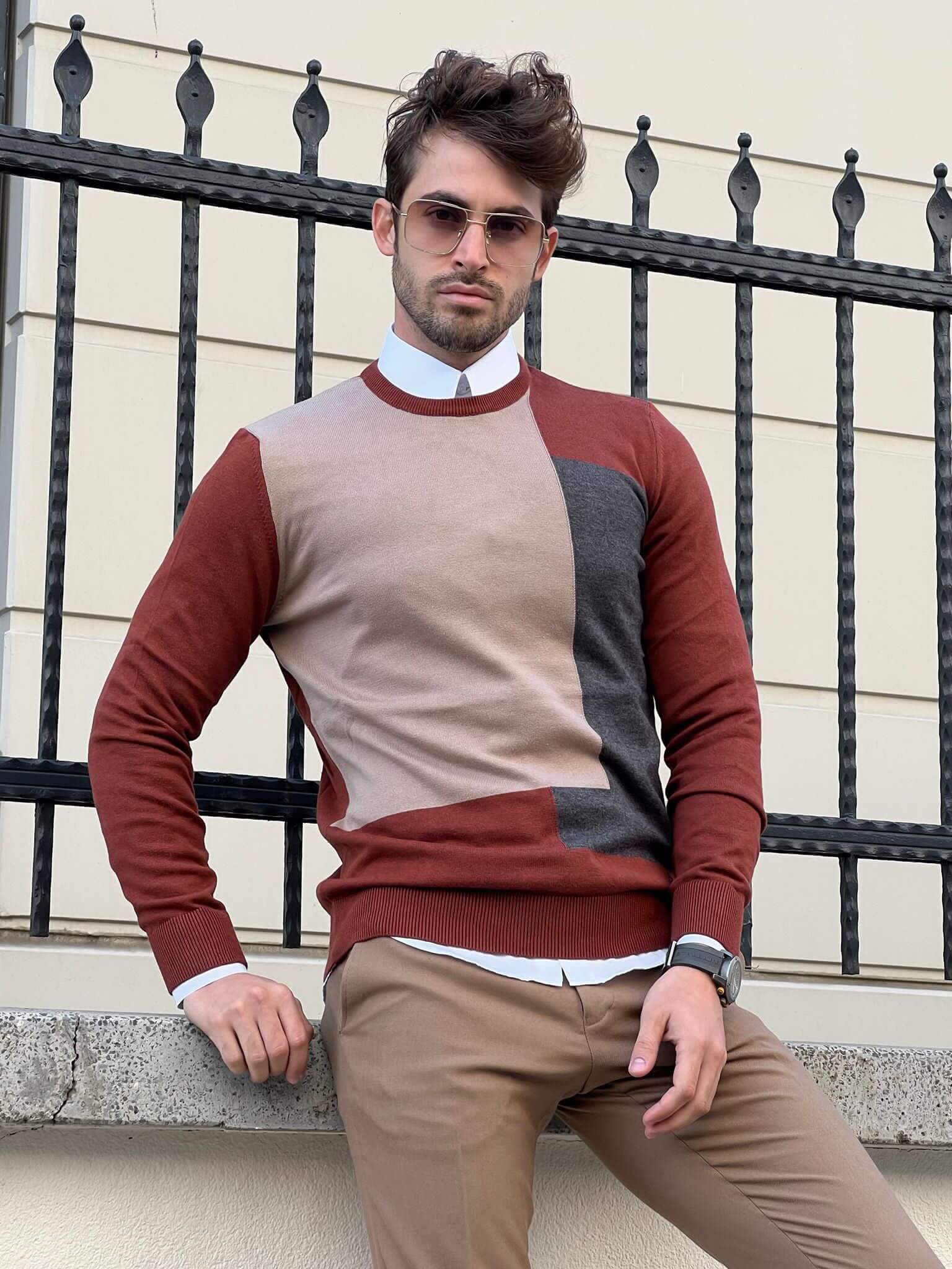 A cozy crewneck sweater with a vibrant pattern of tiles