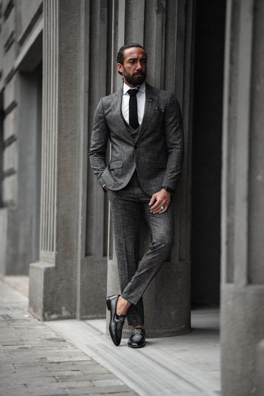 A Self-Patterned Slim Fit Gray Suit on display