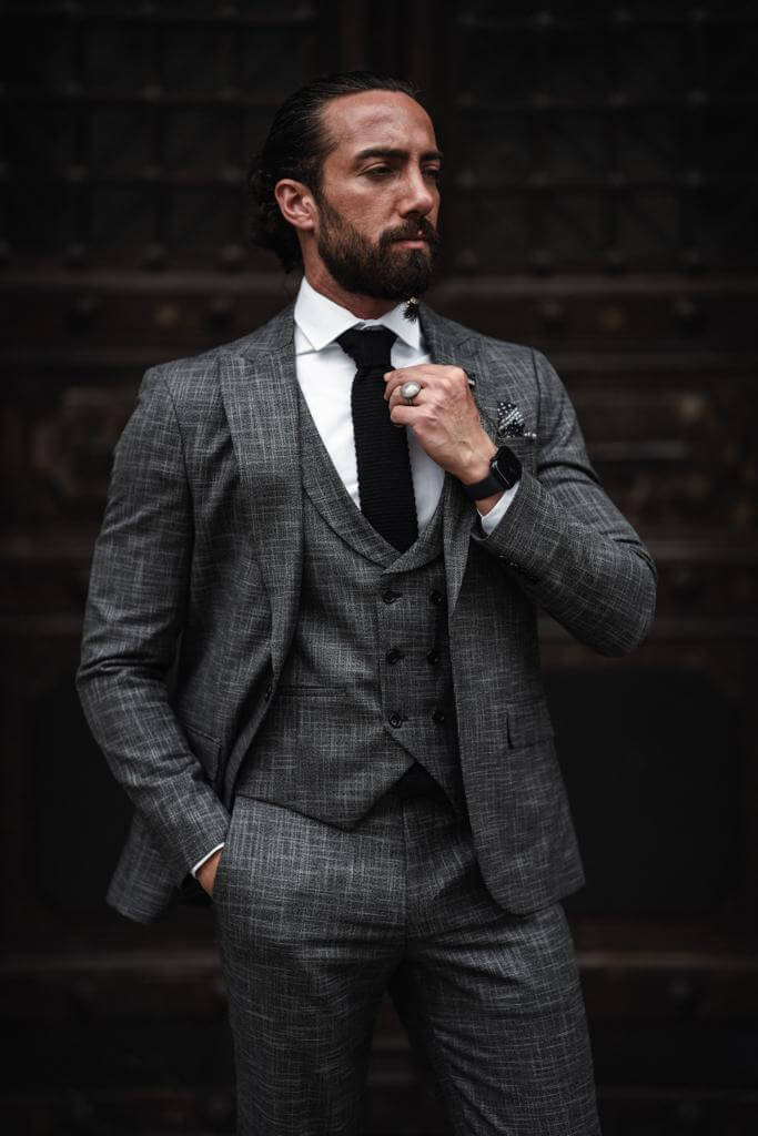 A Self-Patterned Slim Fit Gray Suit on display