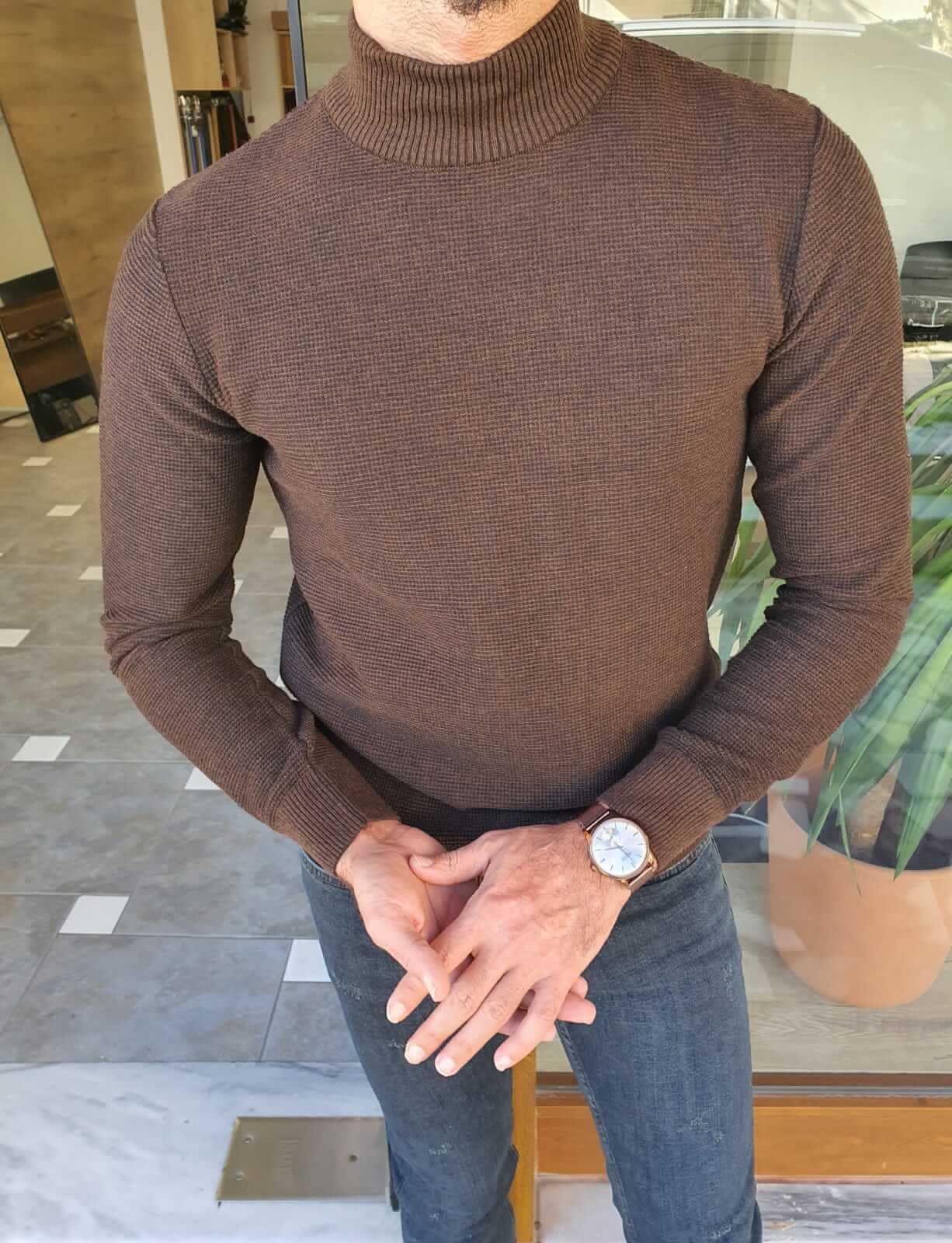 A brown half turtleneck sweater, designed in a slim fit style.