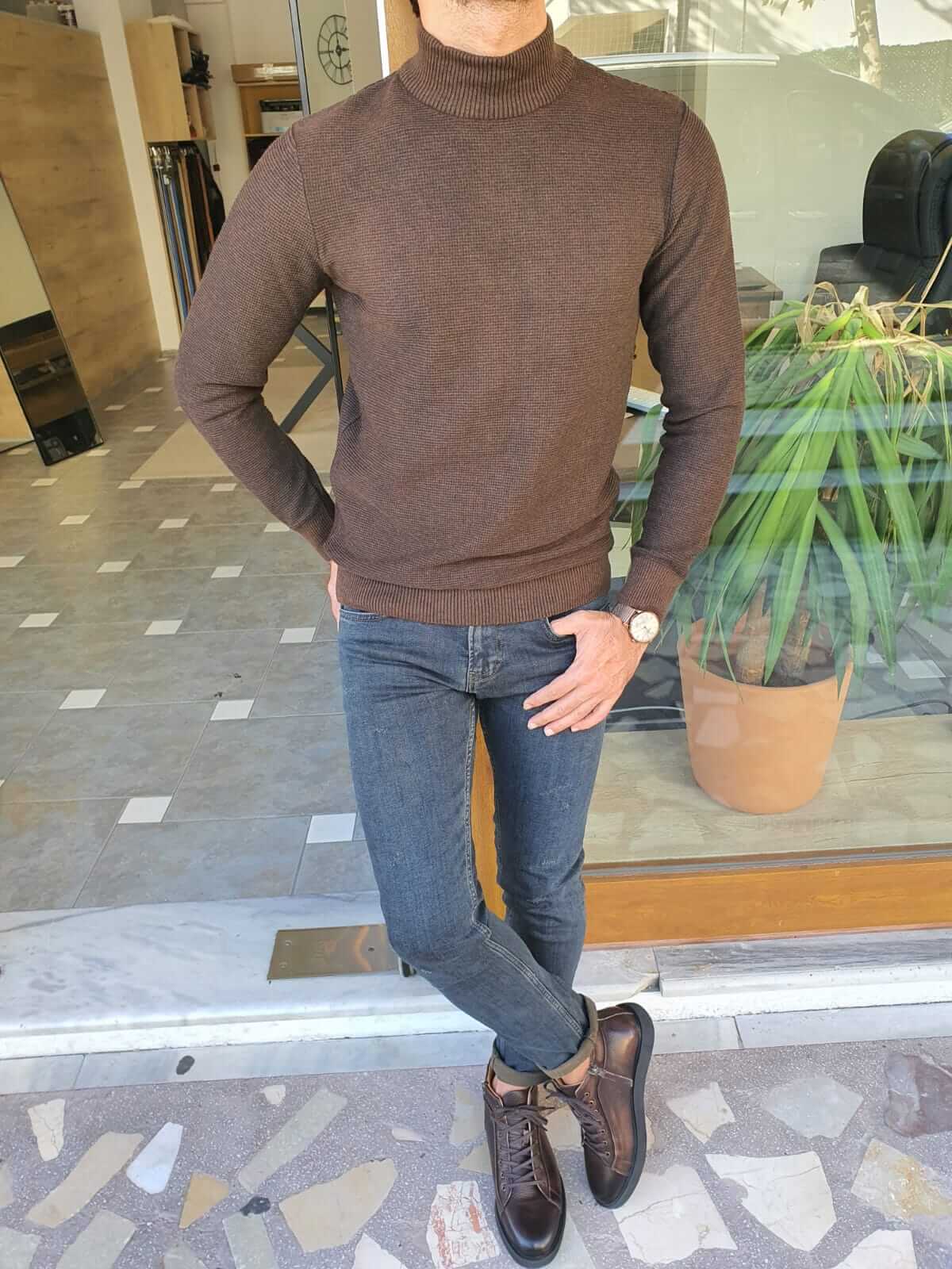 A brown half turtleneck sweater, designed in a slim fit style.