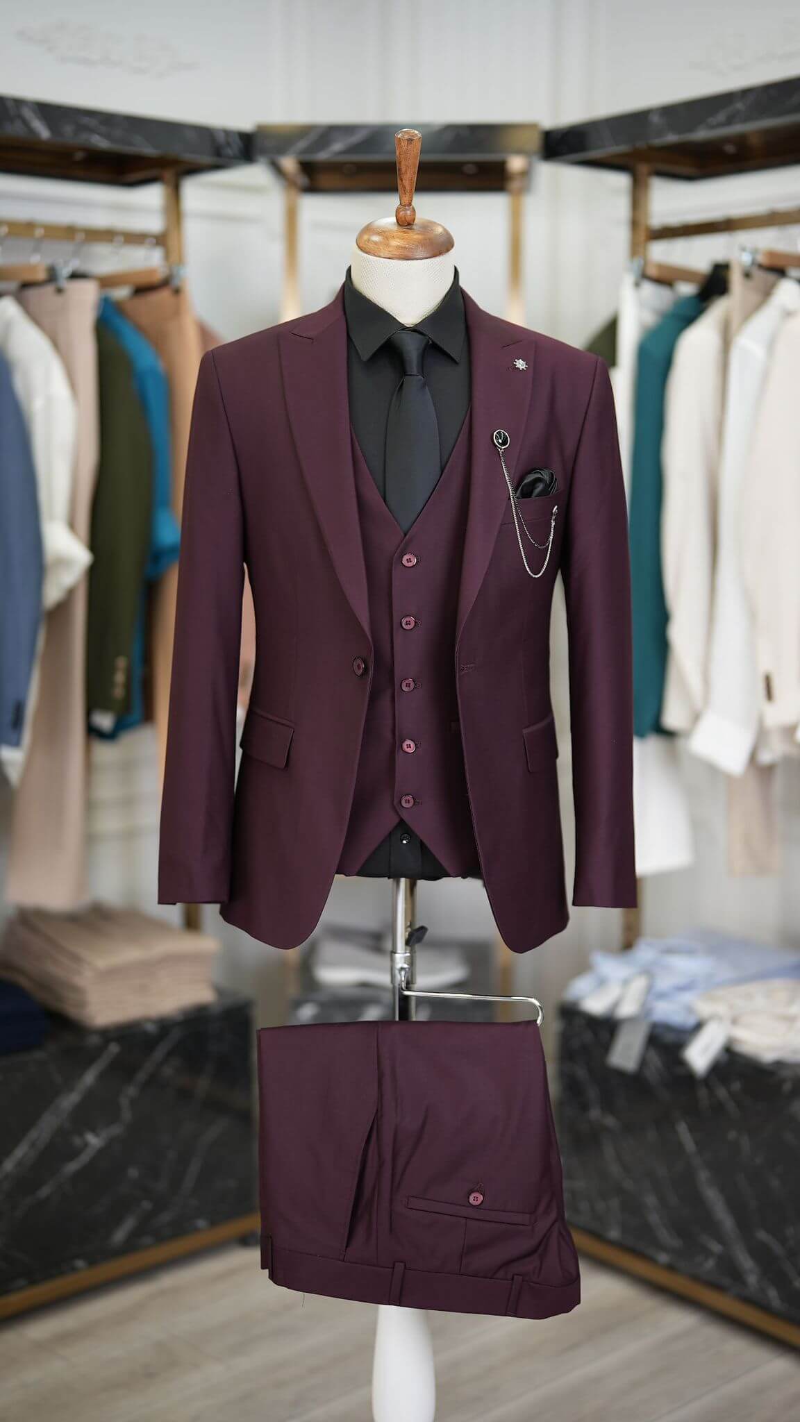 A Burgundy Suit on display. 