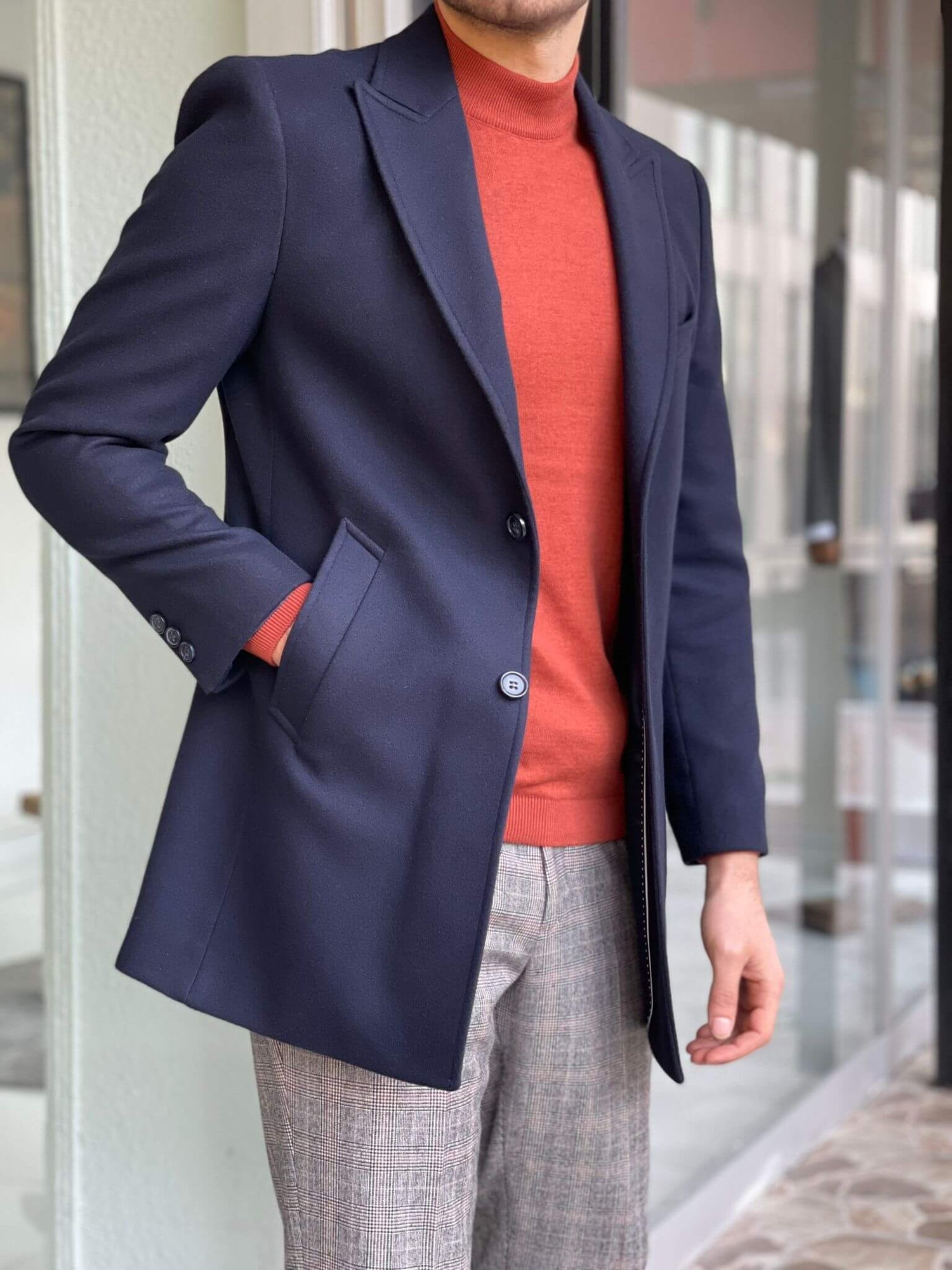 Navy blue wool coat with a slim fit