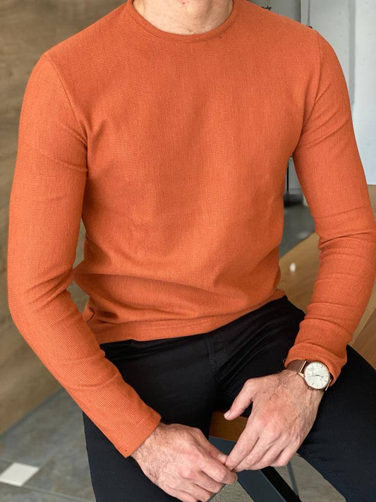 A slim fit orange crewneck sweater, featuring a comfortable crew neckline and a snug fit, perfect for casual or semi-formal occasions."