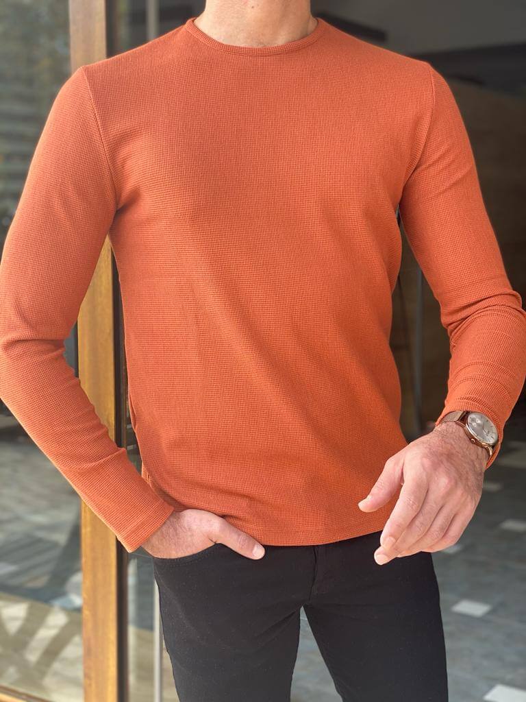 A slim fit orange crewneck sweater, featuring a comfortable crew neckline and a snug fit, perfect for casual or semi-formal occasions."