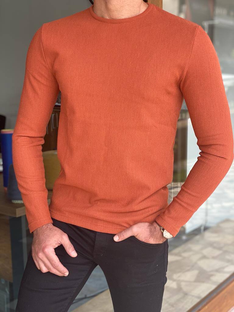 A slim fit orange crewneck sweater, featuring a comfortable crew neckline and a snug fit, perfect for casual or semi-formal occasions."