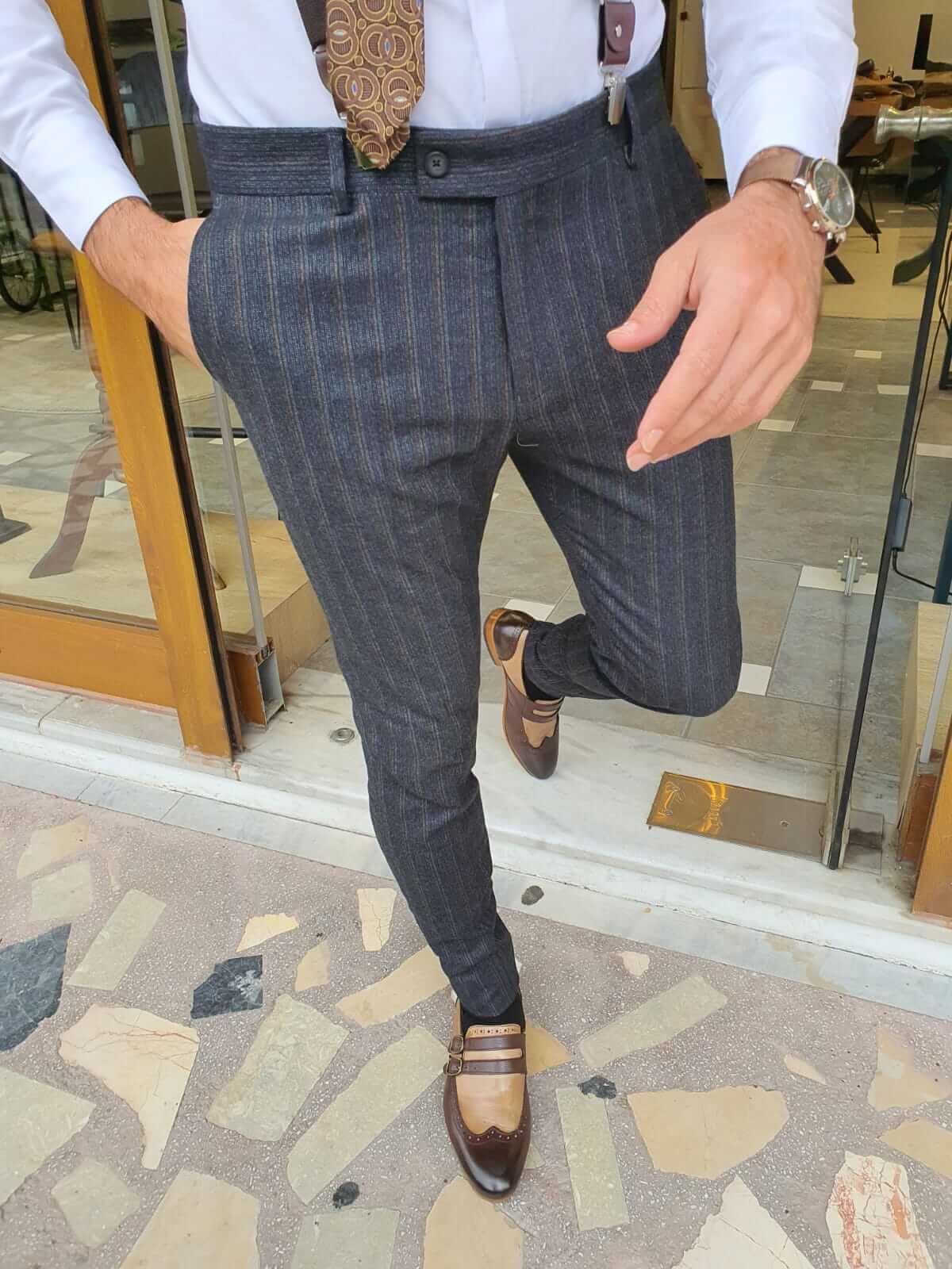 Trendy trousers featuring a sophisticated striped dark blue plaid pattern