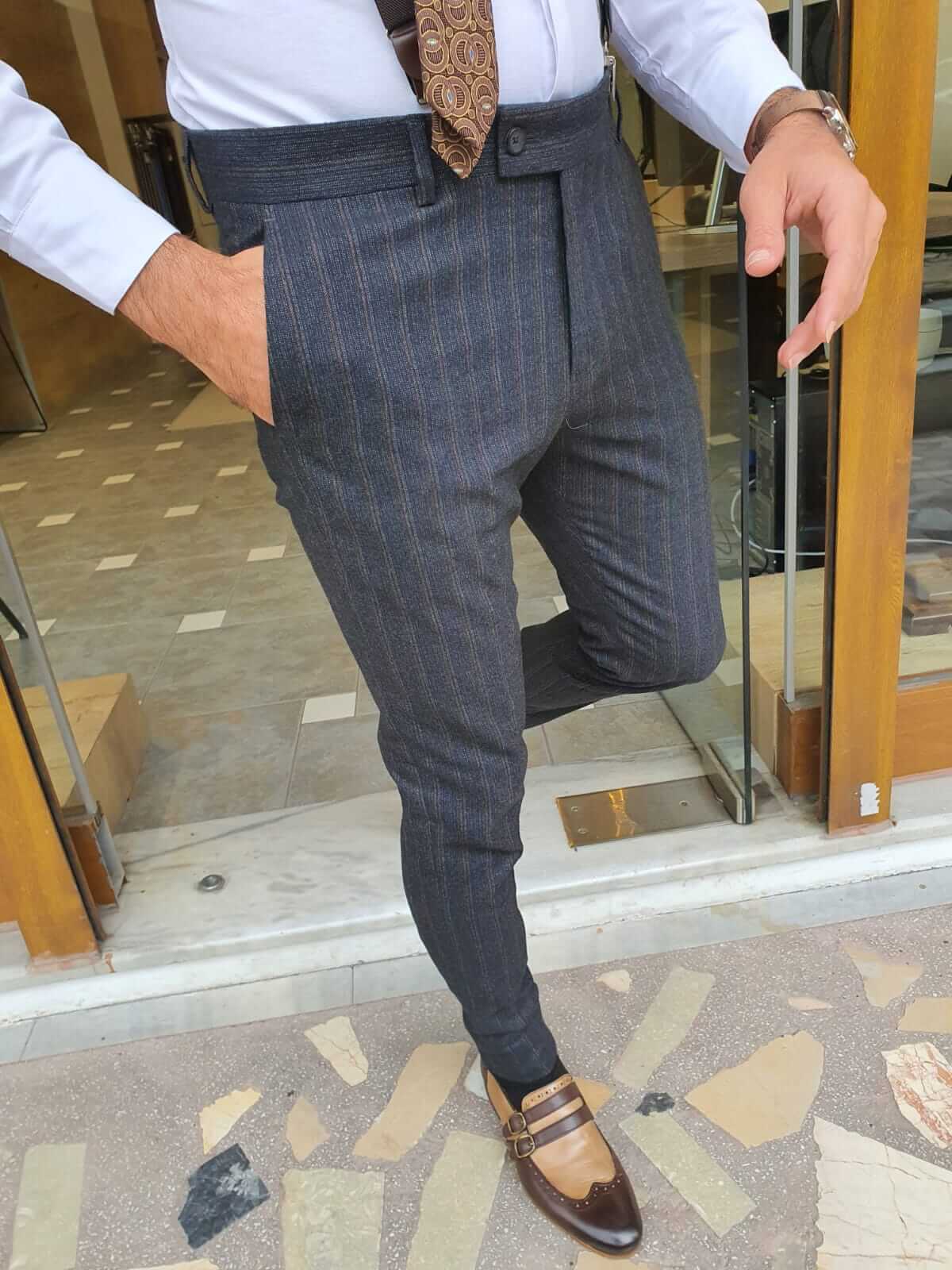Trendy trousers featuring a sophisticated striped dark blue plaid pattern