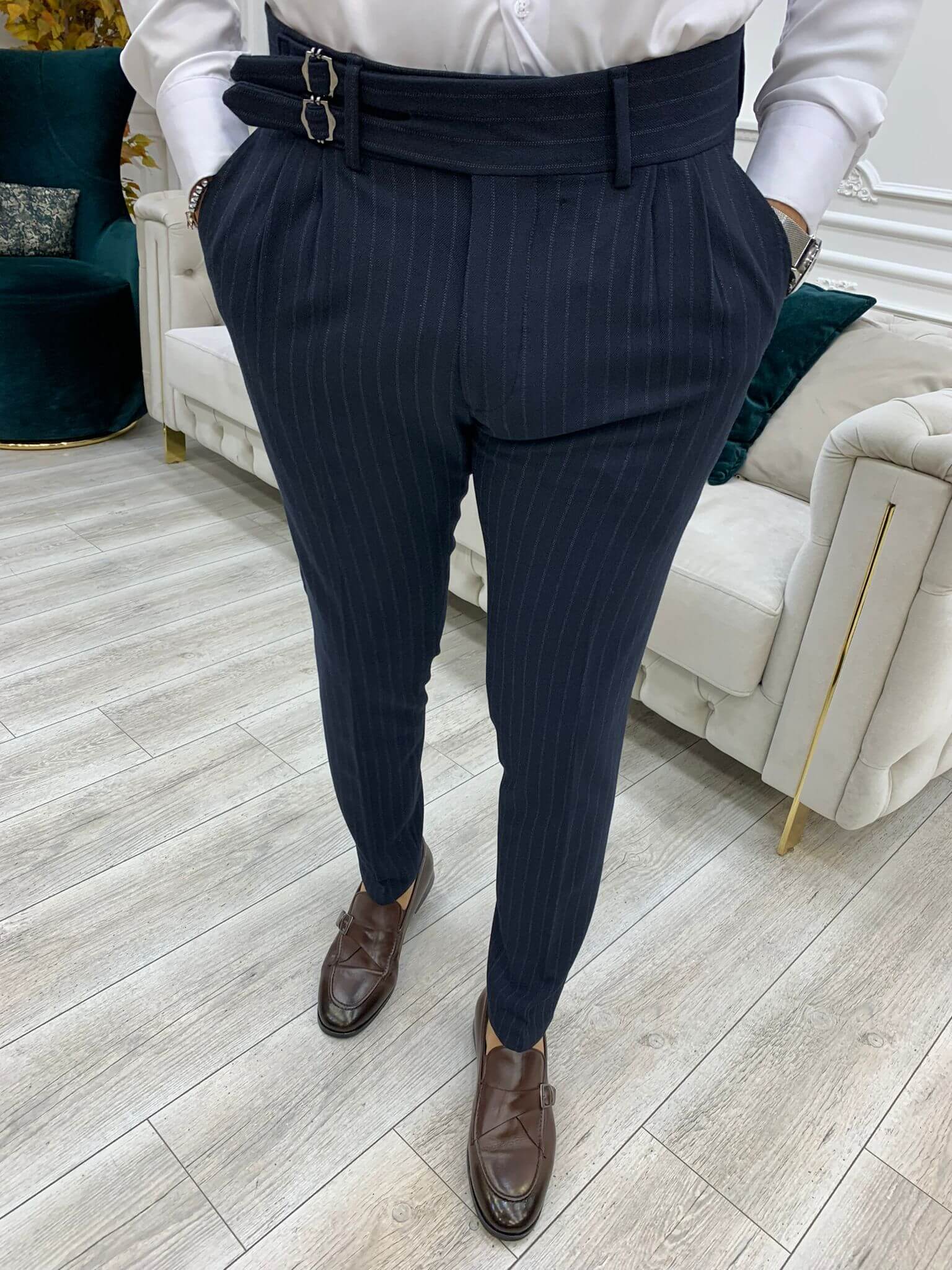 Navy blue striped pants with a stylish buckle detail