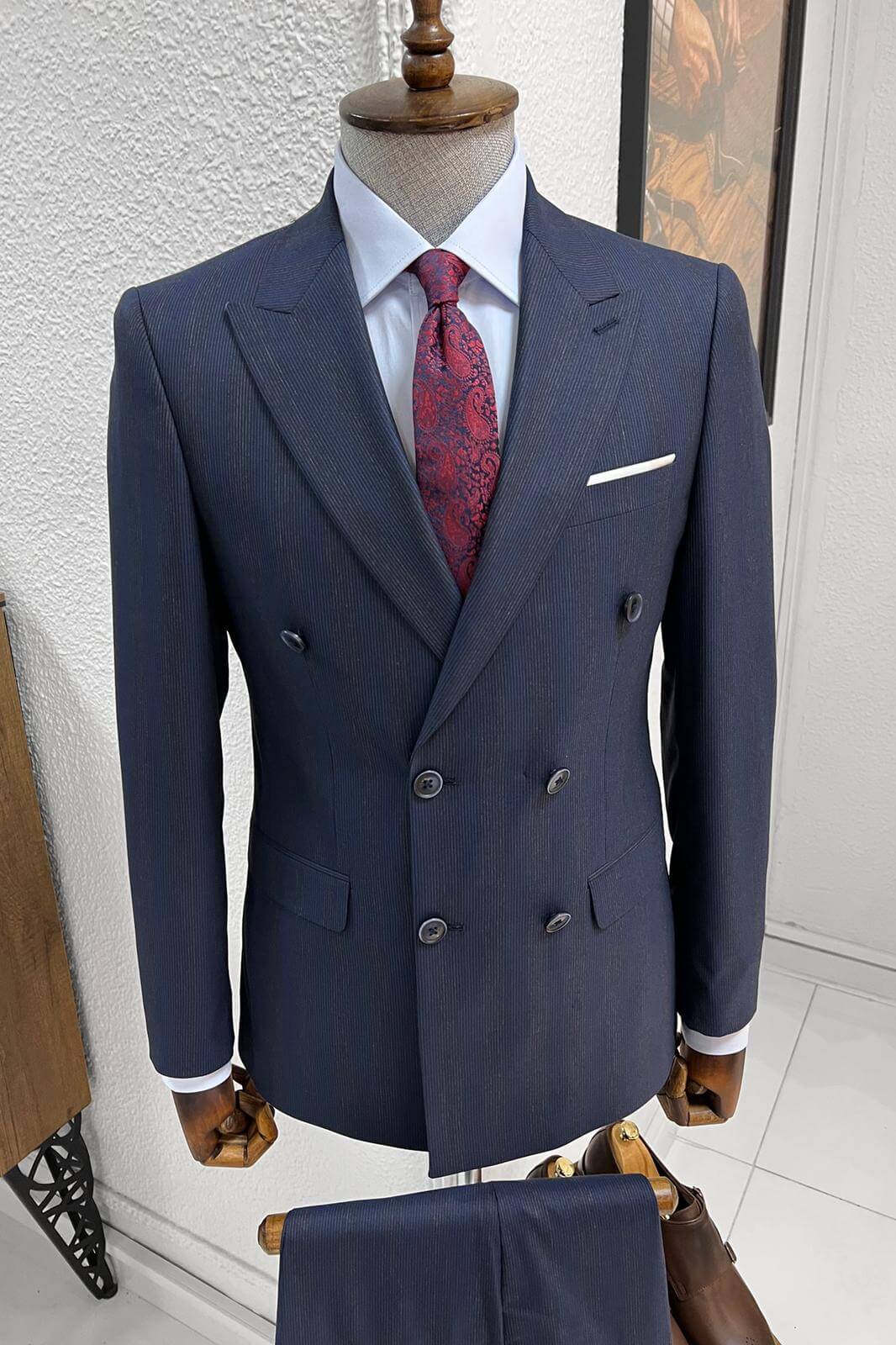 A Striped- Navy-blue- wool suit on display