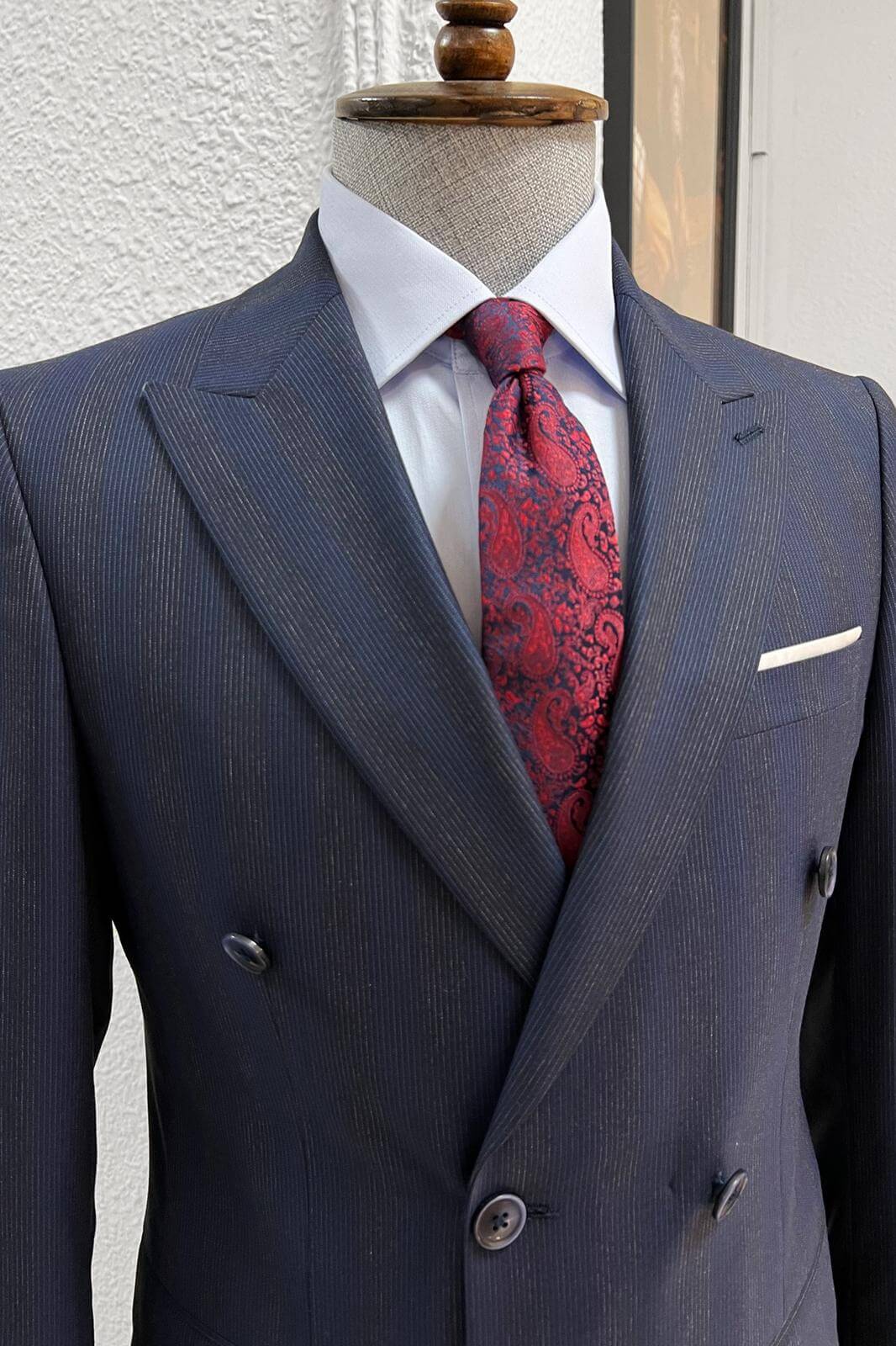 A Striped- Navy-blue- wool suit on display