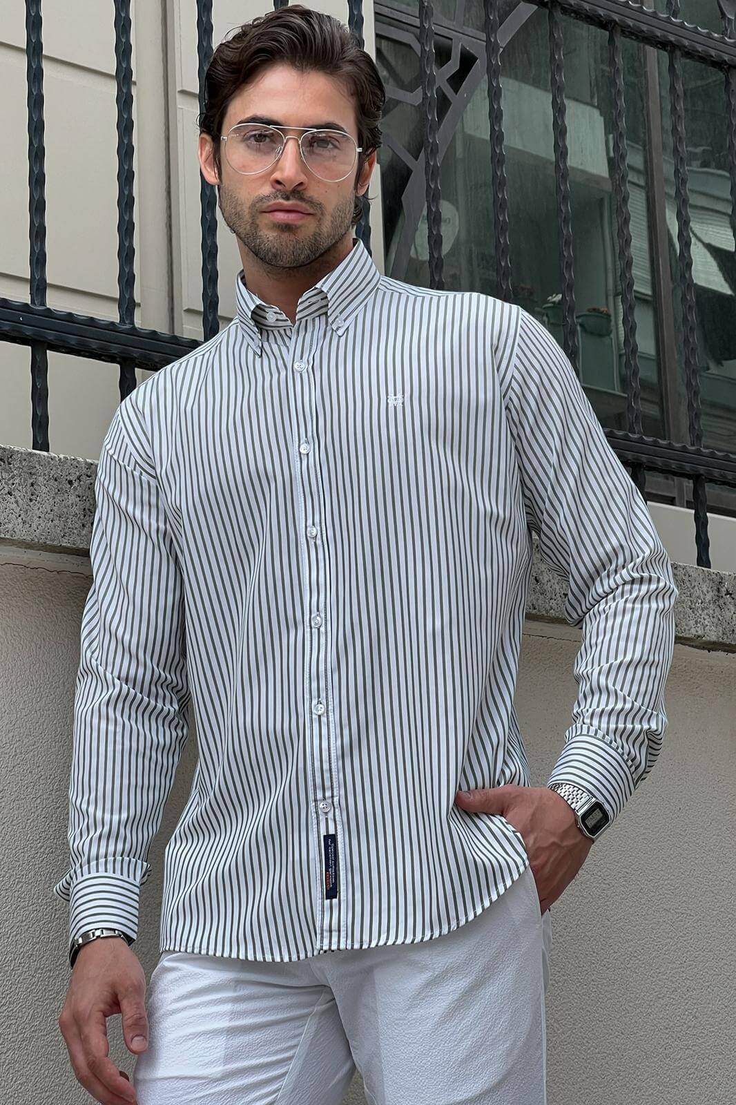 A Slim-Fit Striped White and Green Shirt on display