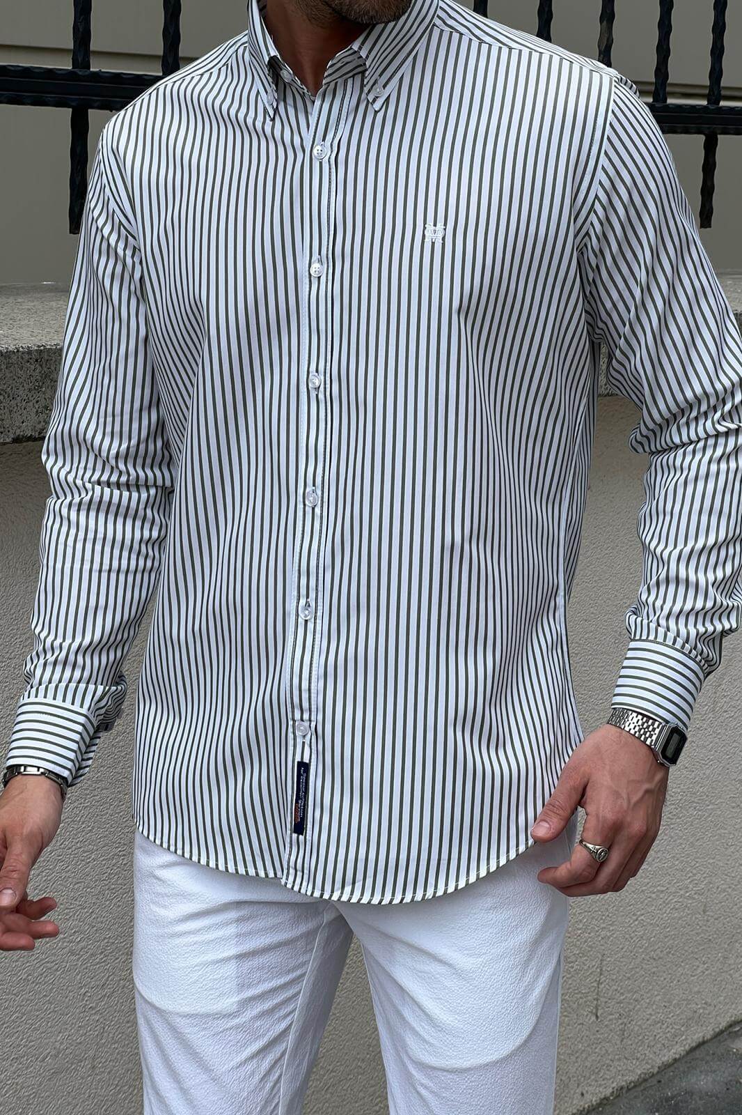 A Slim-Fit Striped White and Green Shirt on display