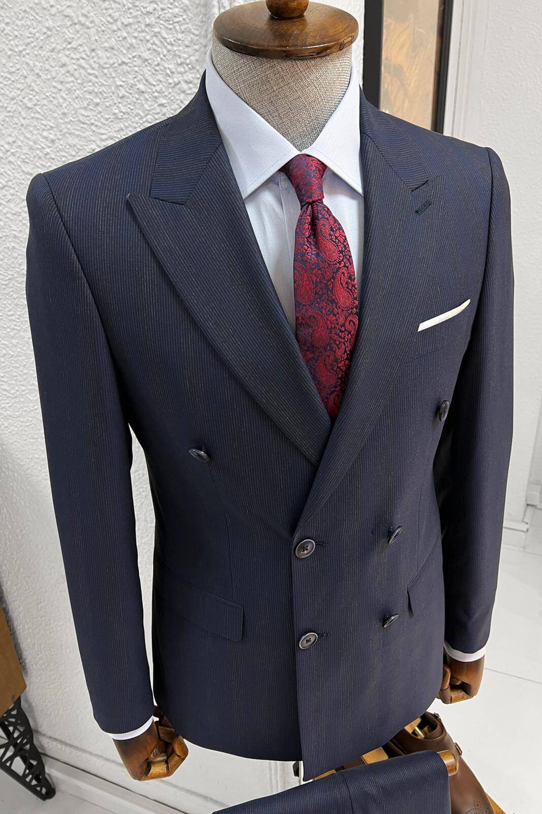 A Slim-fit stripped double-breasted Navy Blue wool suit on display