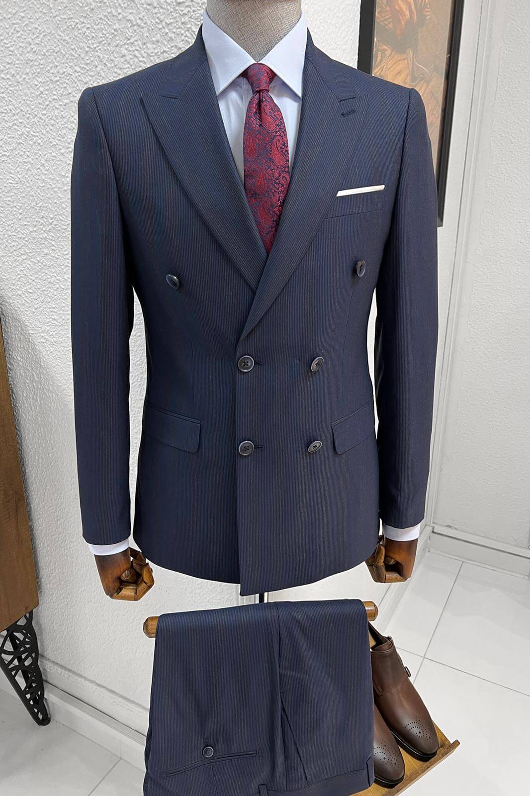 A Slim-fit stripped double-breasted Navy Blue wool suit on display