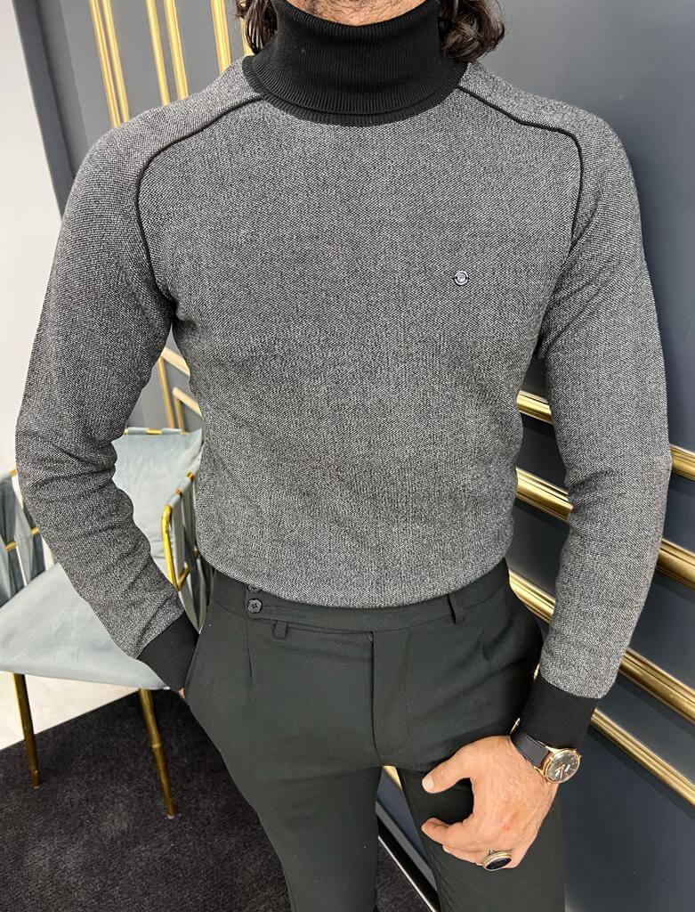 A close-up of a sleek black turtleneck sweater called Tigris, featuring a form-fitting design and a high collar.