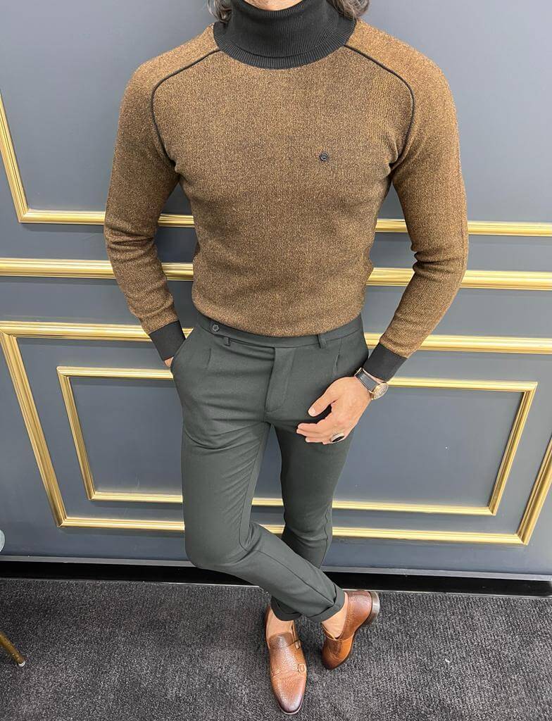 A stylish Tigris Camel Turtleneck sweater, featuring a high neck and a soft, textured knit pattern in warm camel tones."