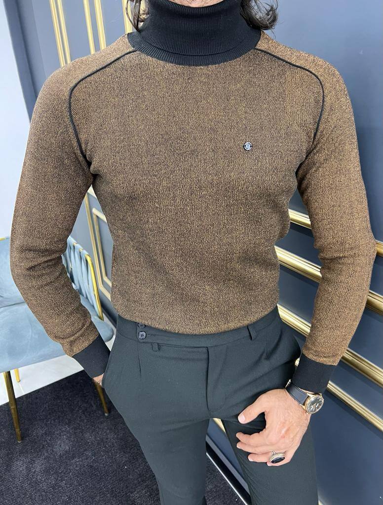 A stylish Tigris Camel Turtleneck sweater, featuring a high neck and a soft, textured knit pattern in warm camel tones."