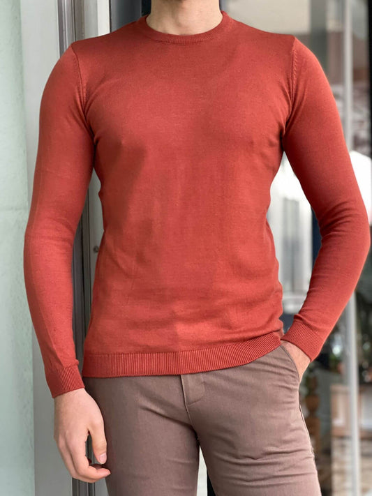 A cozy crewneck sweater in a textured tile pattern, featuring a blend of warm colors and a soft knit fabric."