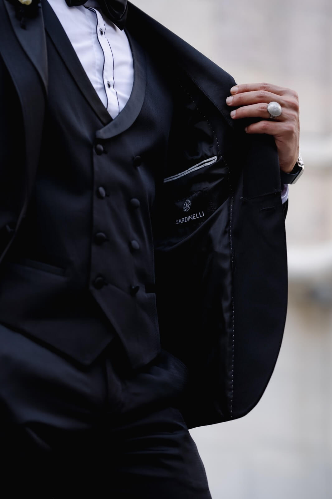 A Slim Fit Black Tuxedo Suit on display.