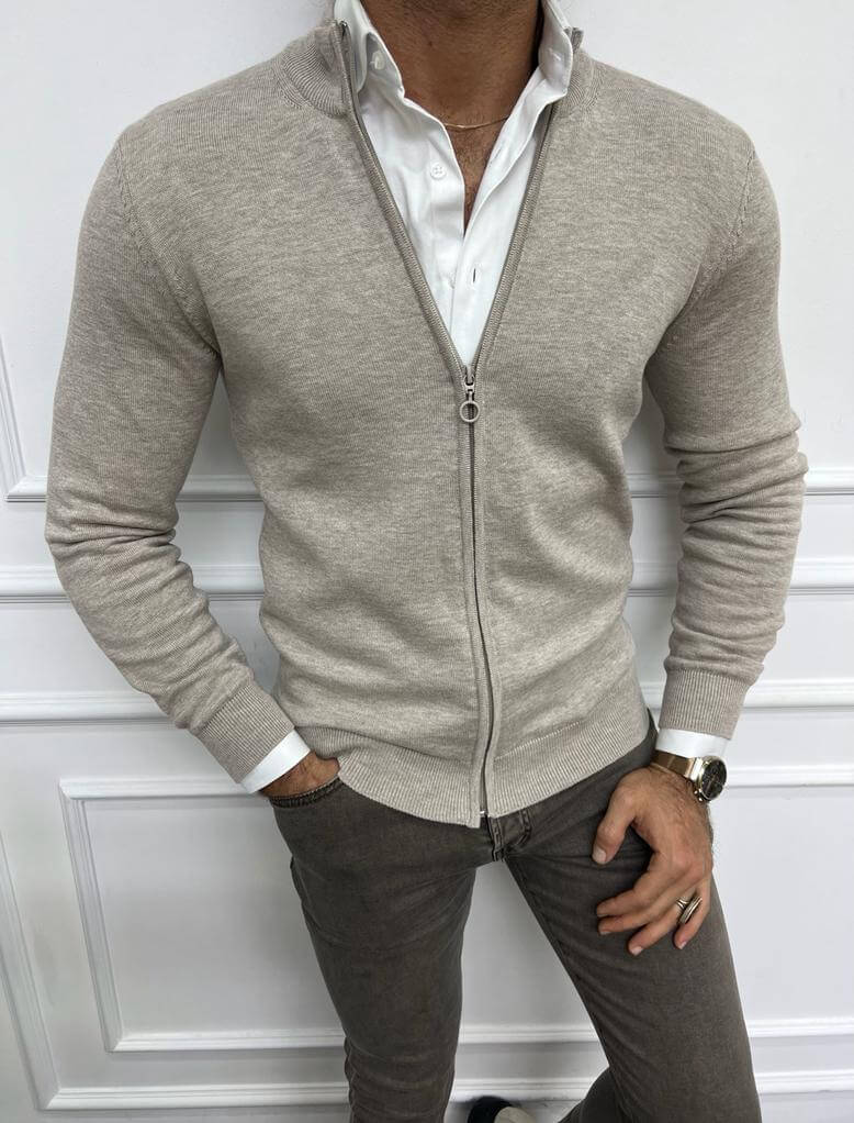  A chic and versatile beige V-neck cardigan worn by a model.