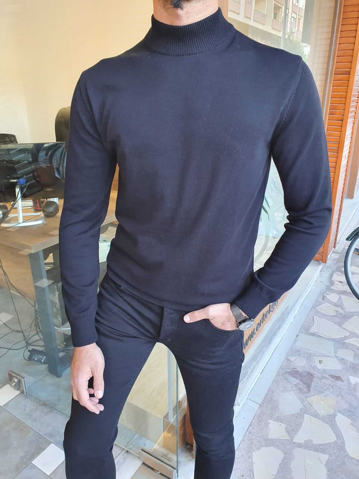 "Vale Black Turtleneck: A sleek and stylish black turtleneck sweater made from soft, high-quality fabric.