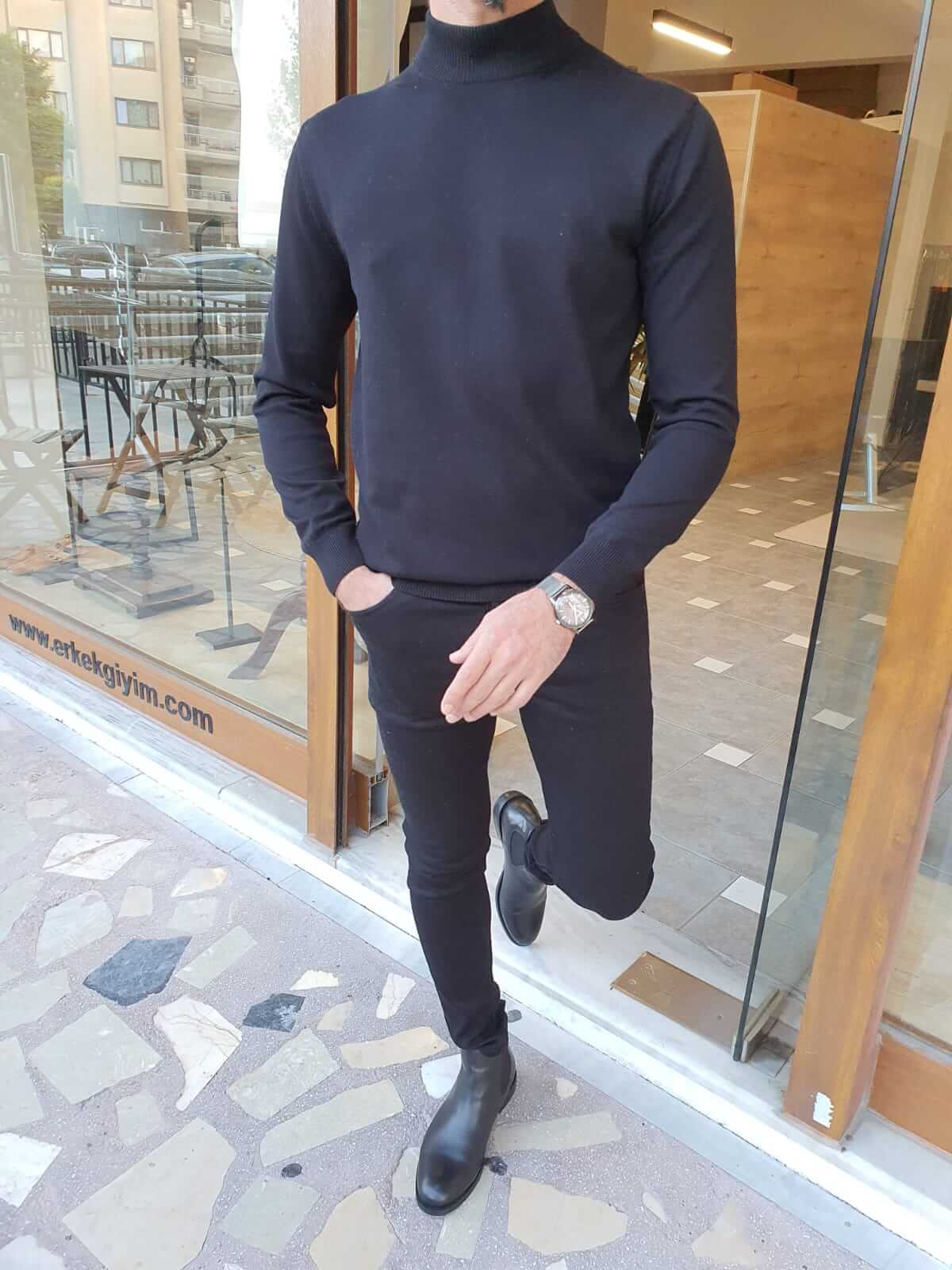 "Vale Black Turtleneck: A sleek and stylish black turtleneck sweater made from soft, high-quality fabric.