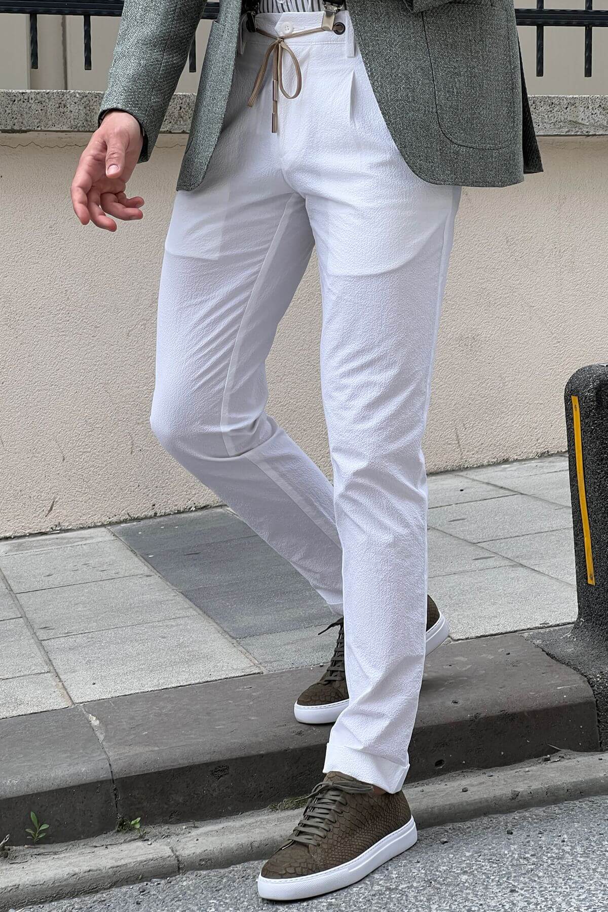 A Slim Fit White Cotton Trouser on display