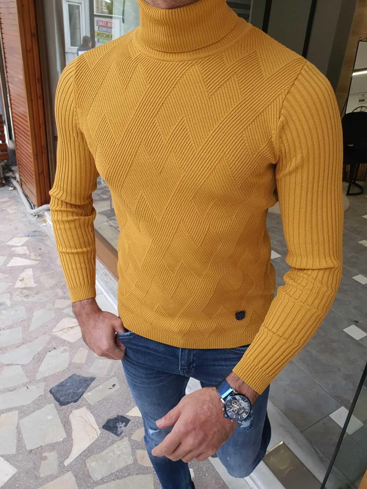 A yellow long sleeve turtleneck sweater, featuring a high neckline and fitted sleeves."