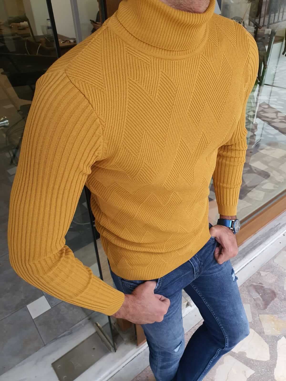 A yellow long sleeve turtleneck sweater, featuring a high neckline and fitted sleeves."