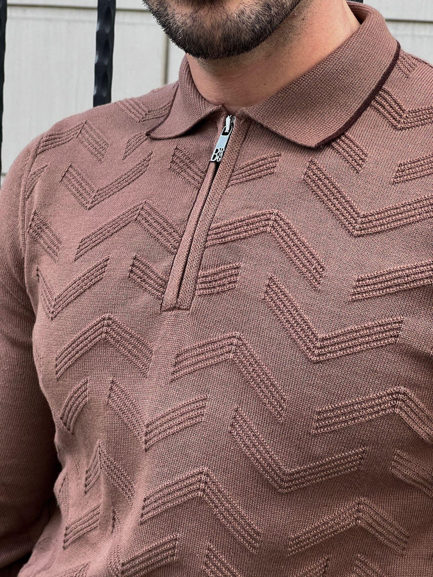  A stylish Zipper Neck Mink Sweater, featuring a sleek zipper detail on the neckline.